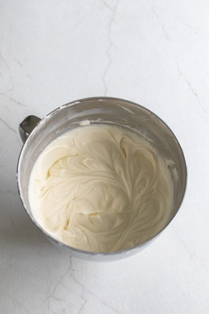 Cream cheese mixture in a stainless steel bowl.
