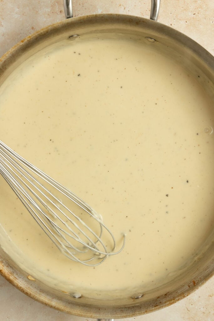 Gravy cooking in a pan.
