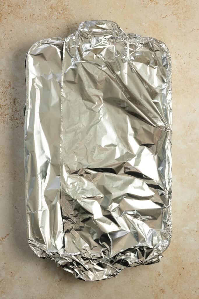 A pan covered in a aluminum foil.