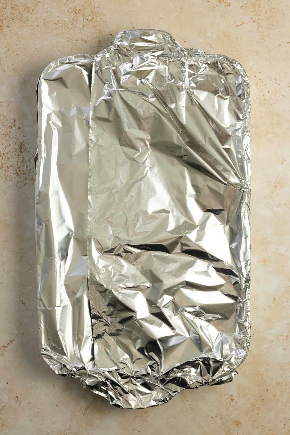 A pan covered in a aluminum foil.