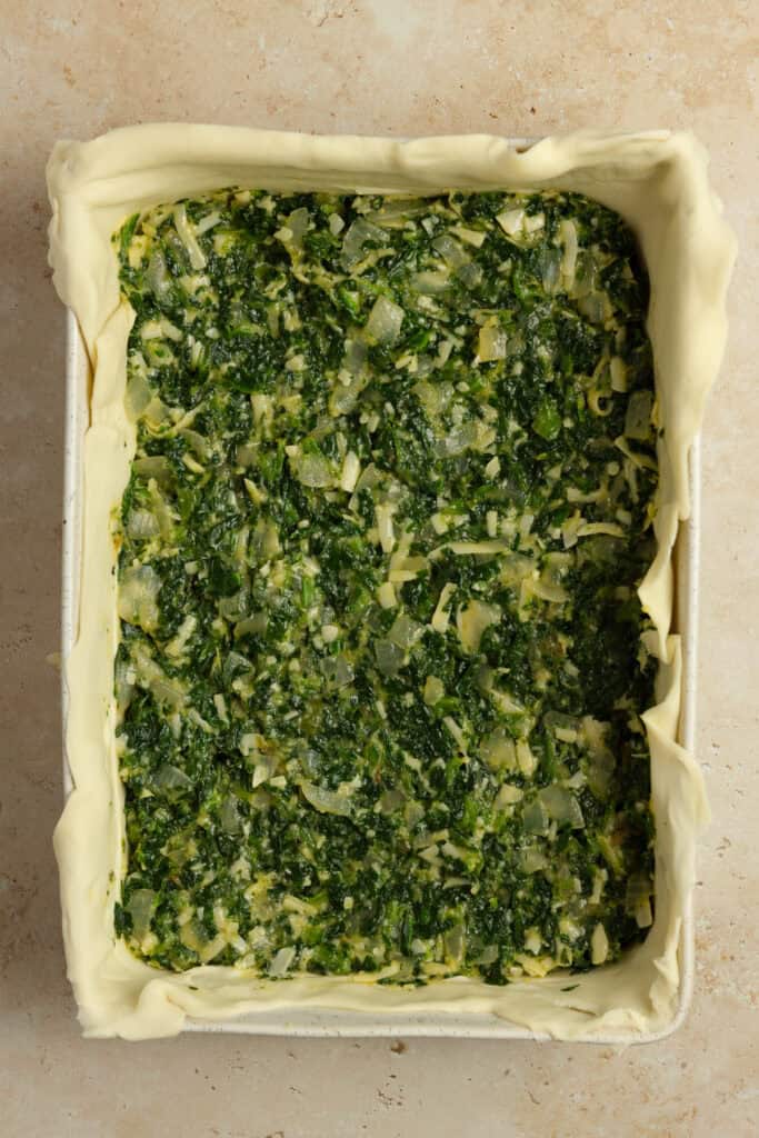 Spinach mixture layered in a puff pastry crurst.