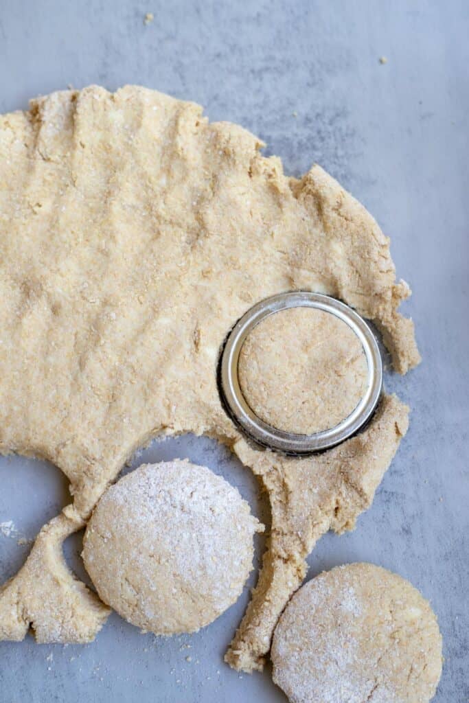 Cutting out whole wheat biscuit dough.