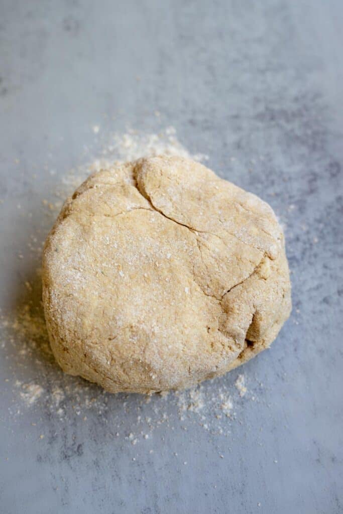 Whole wheat biscuit dough on a countertop.