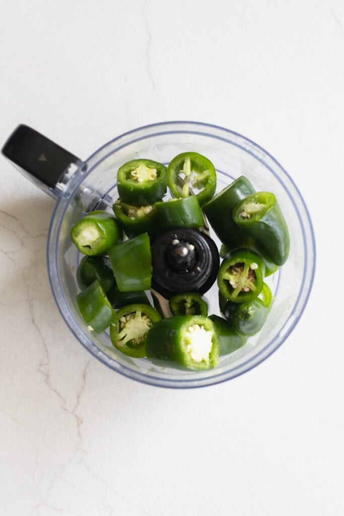 Diced jalapenos in a food processor.