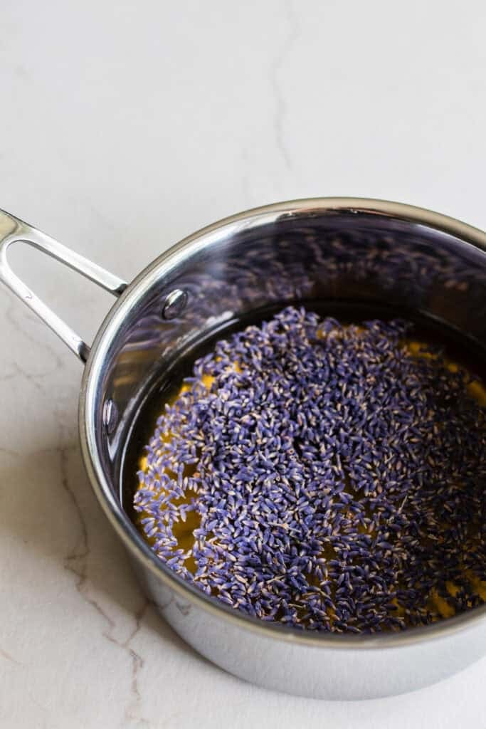 Lavender syrup simmering in a saucepan. 