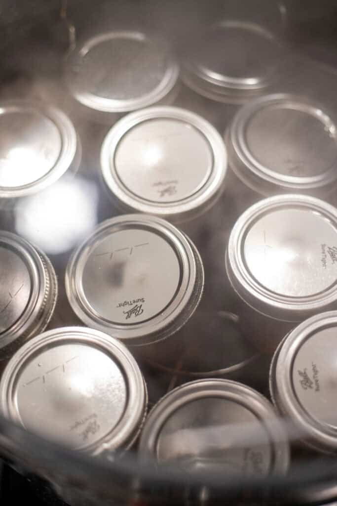 Jelly jars in a water bath canner.