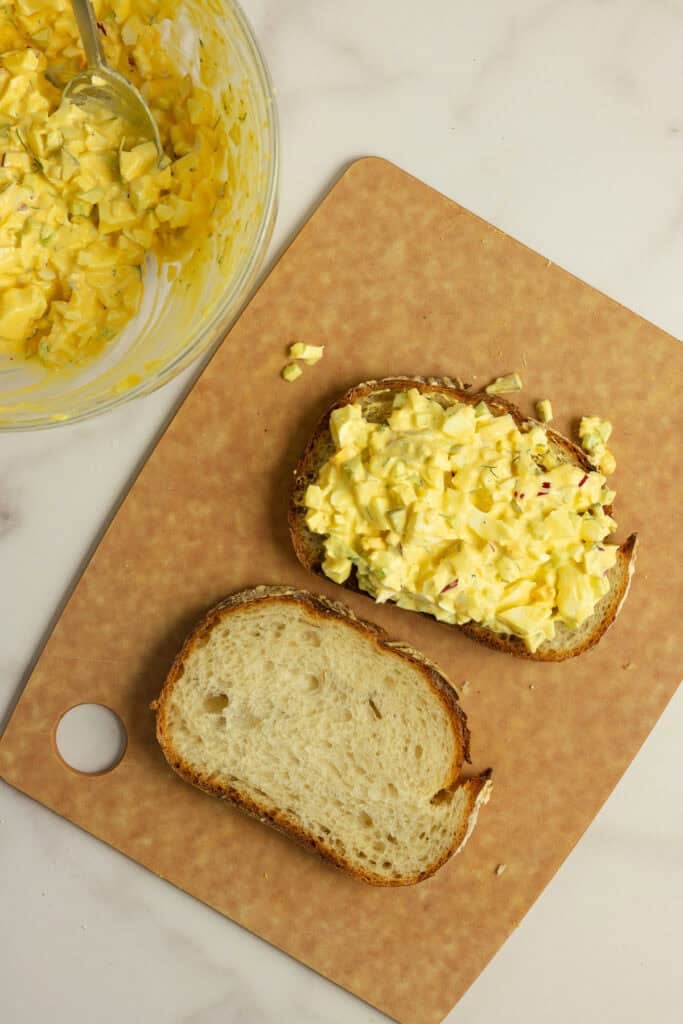 Egg salad on one slice of sourdough bread.