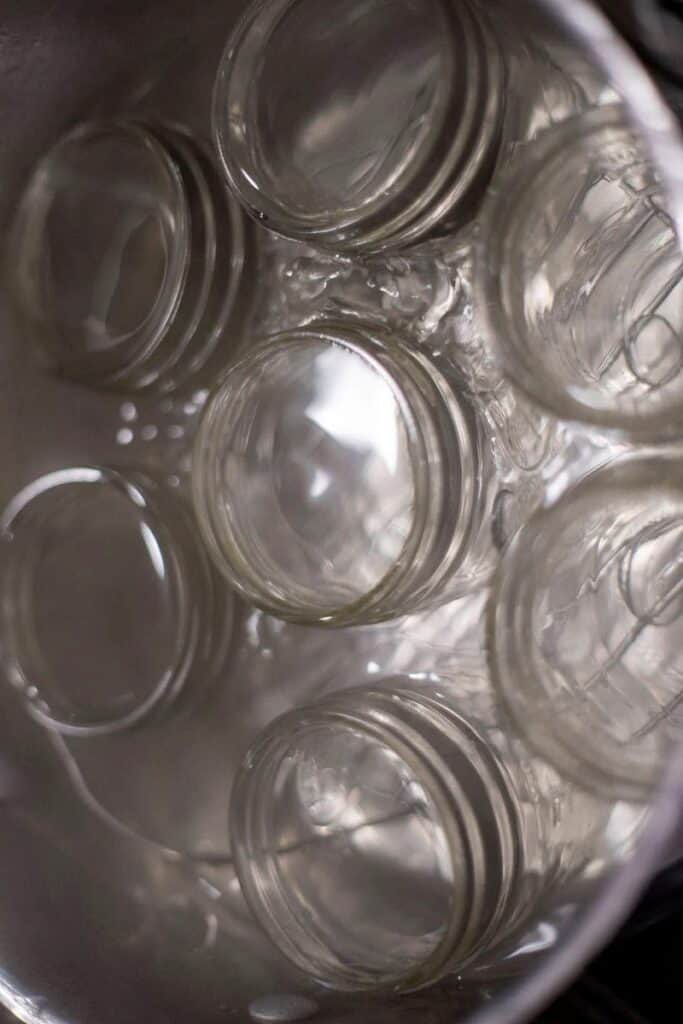 Jars in a pot of water.