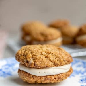 an oatmeal cream pie sitting on a blue plate.