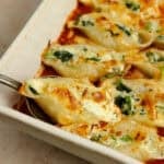 fully cooked pasta shells stuffed with ricotta cheese and covered with marinara sauce.