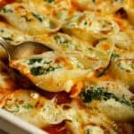 cooked jumbo pasta shells in a dish.