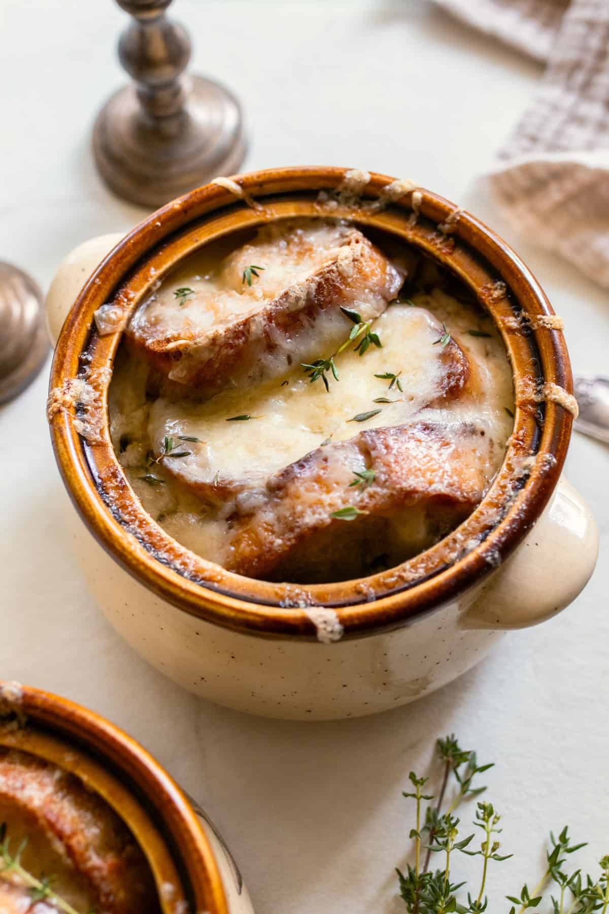 French onion soup with fresh bread in a crock pot. 