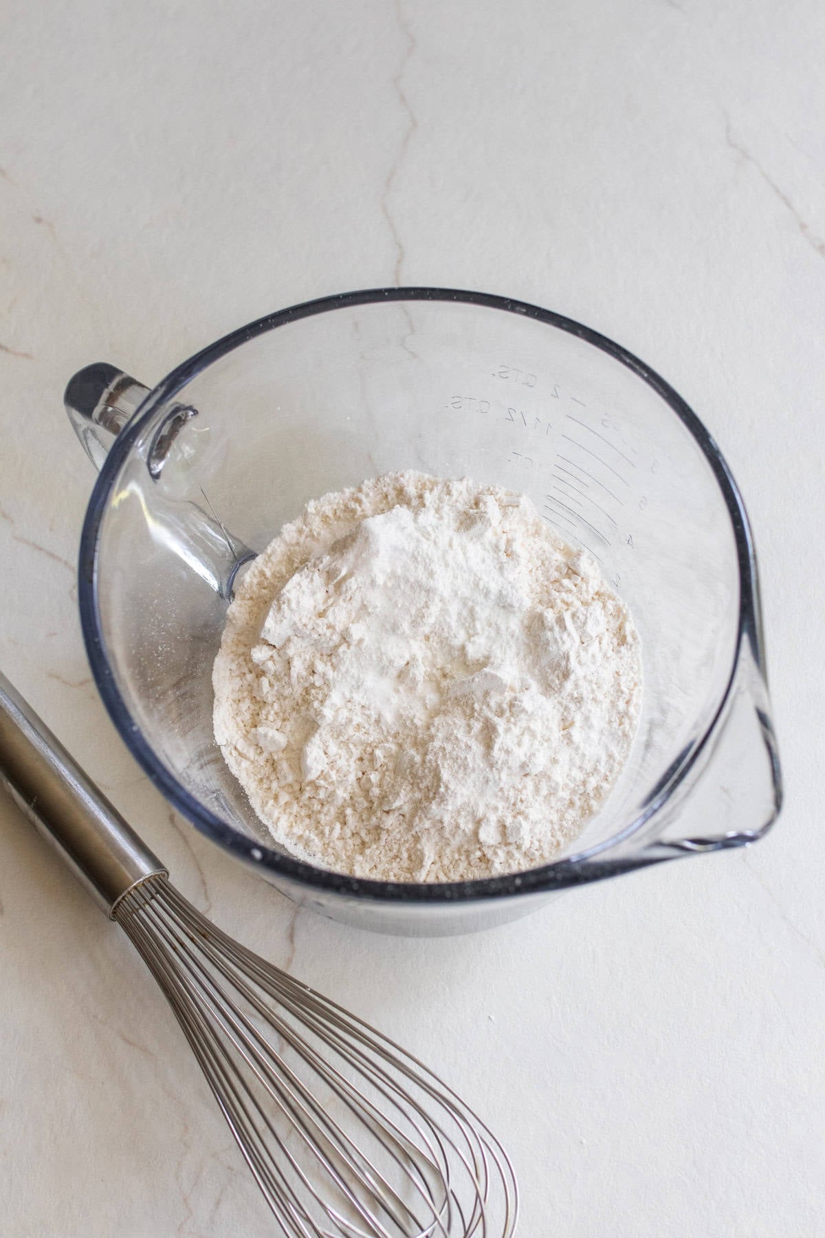 Dry ingredients mixed into a glass bowl.