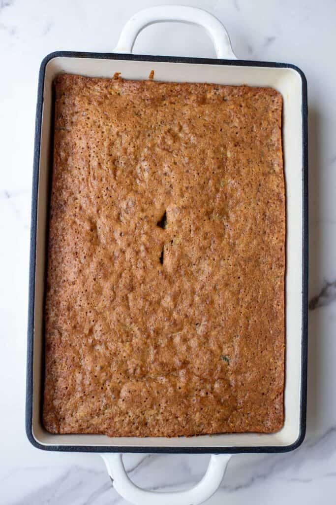 Zucchini cake baked in a 9-inch x 13-inch dish.