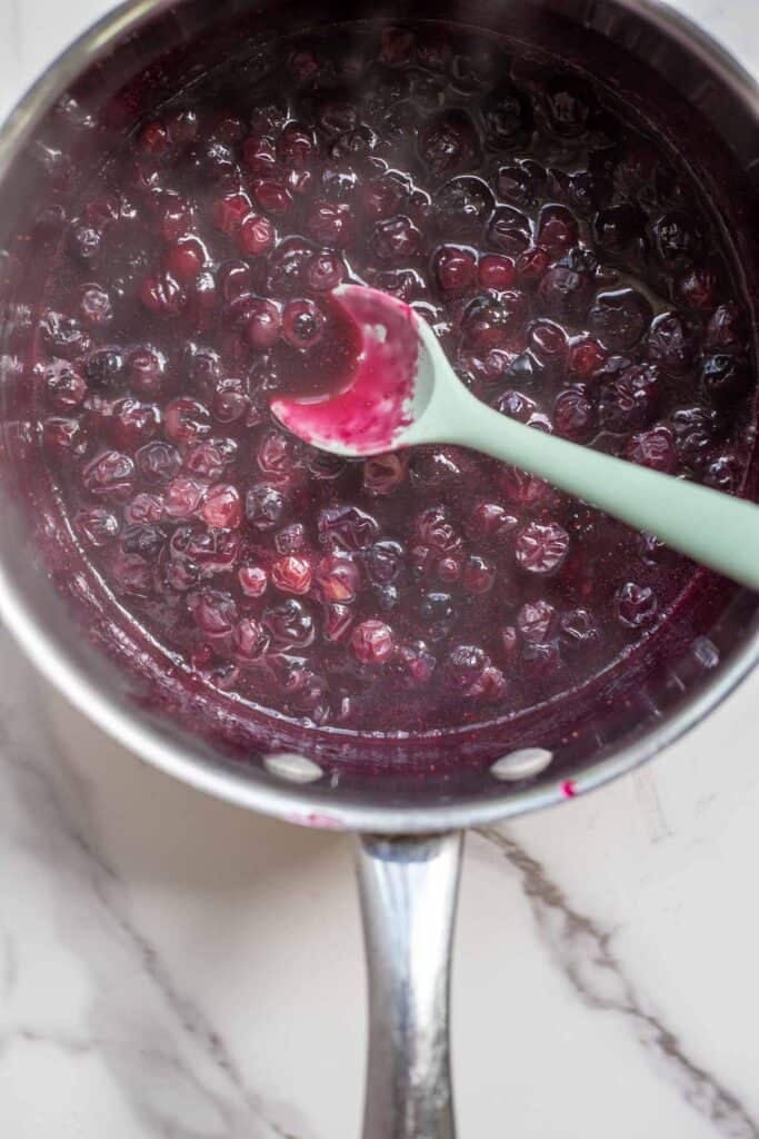 Thickened blueberries over the stove.