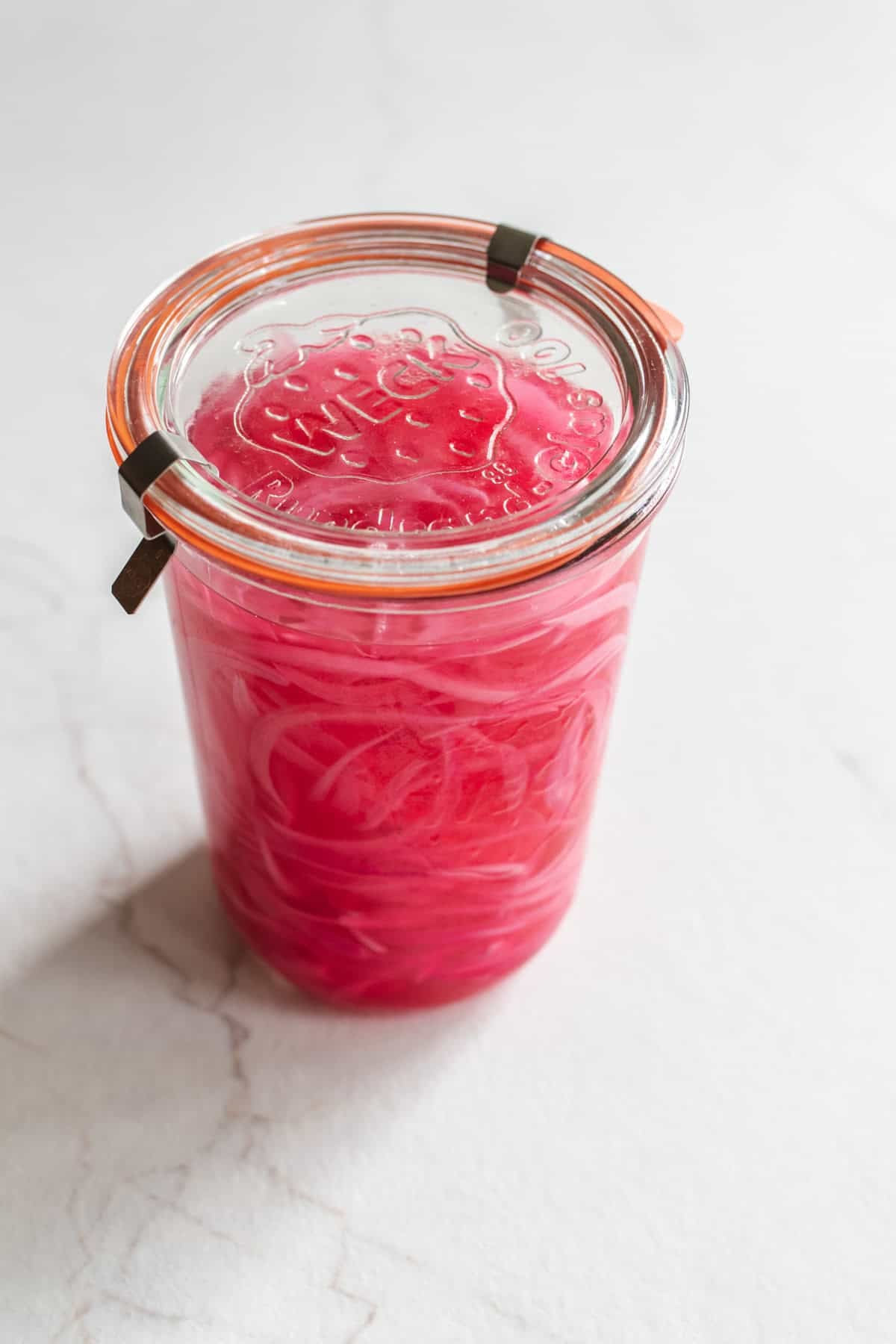 Jar of pickled red onions in a jar.