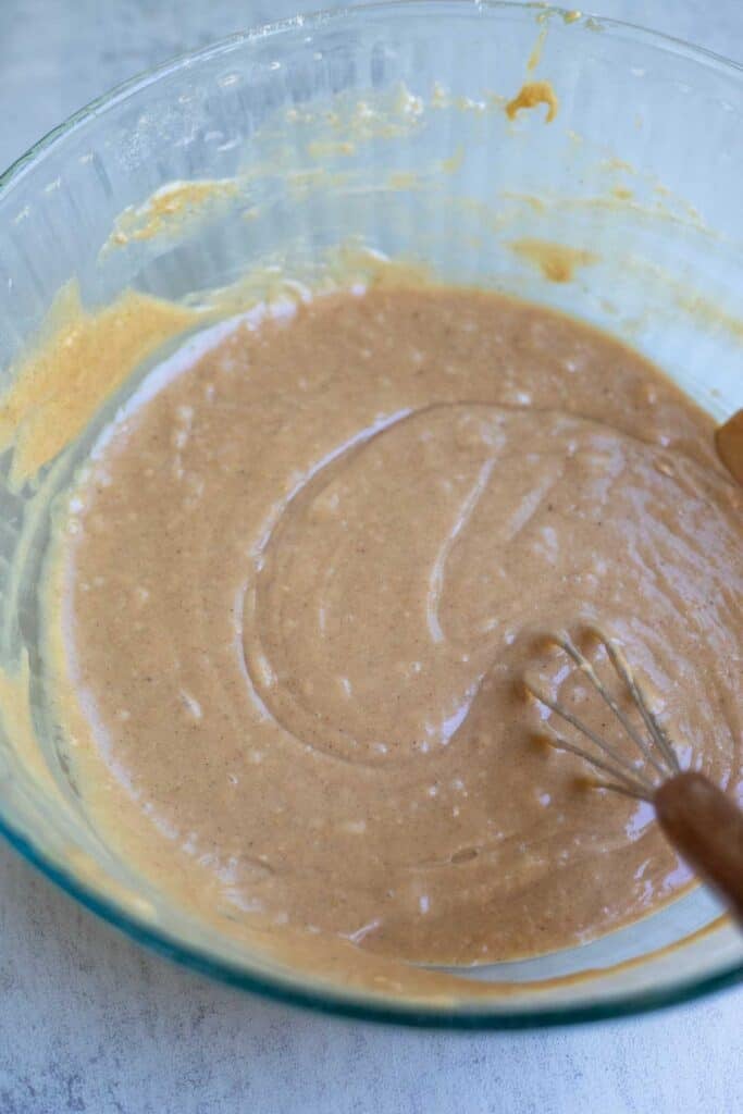 Apple cider, butter, vanilla, and milk added to the dry ingredients.