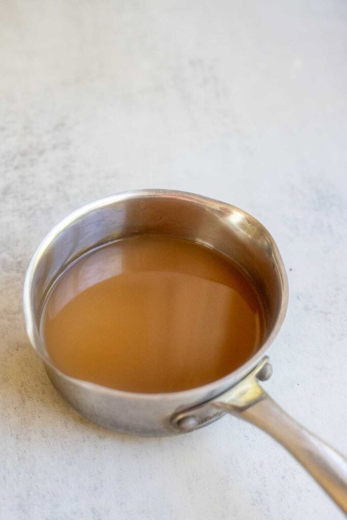 Apple cider in a simmering pot.