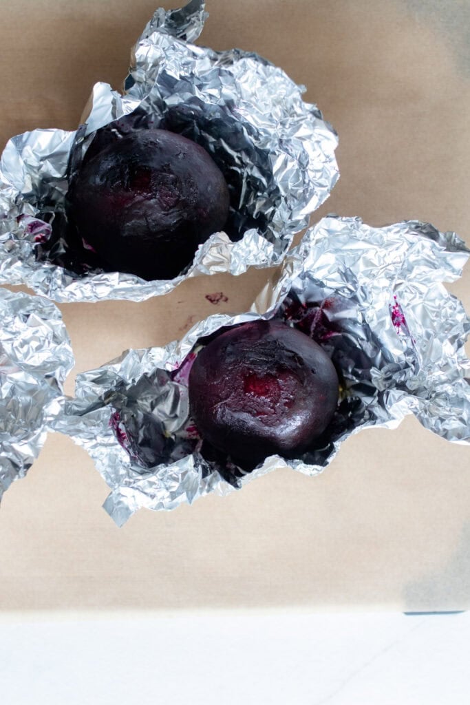 Beets in aluminum foil after being roasted.