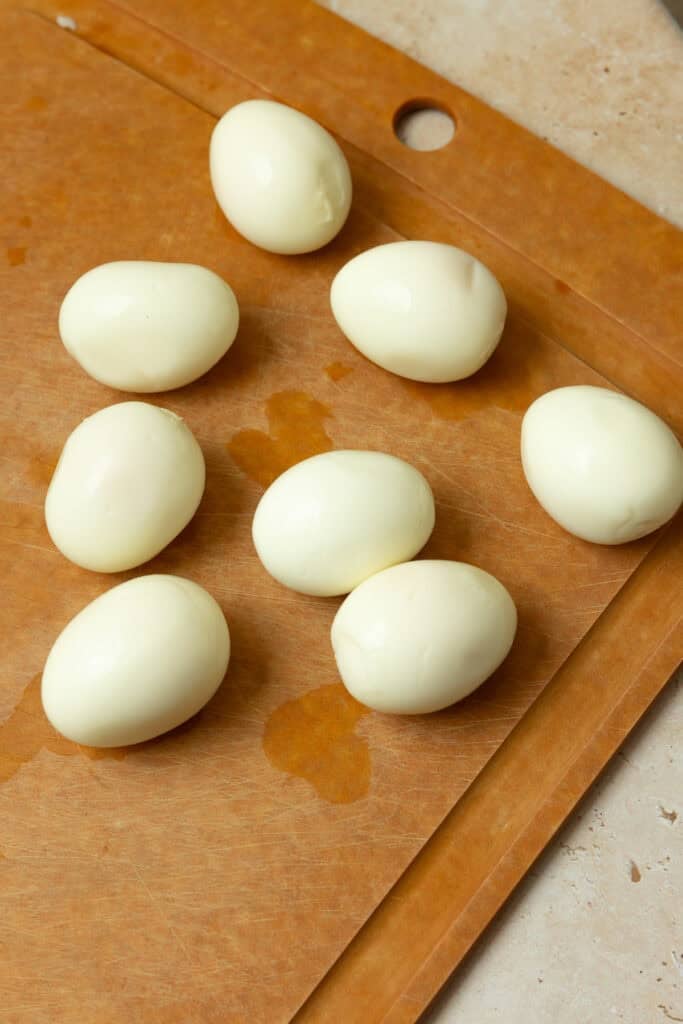 Hard boiled eggs on a countertop.