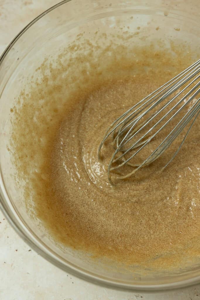 Wet ingredients whisked together in a bowl.
