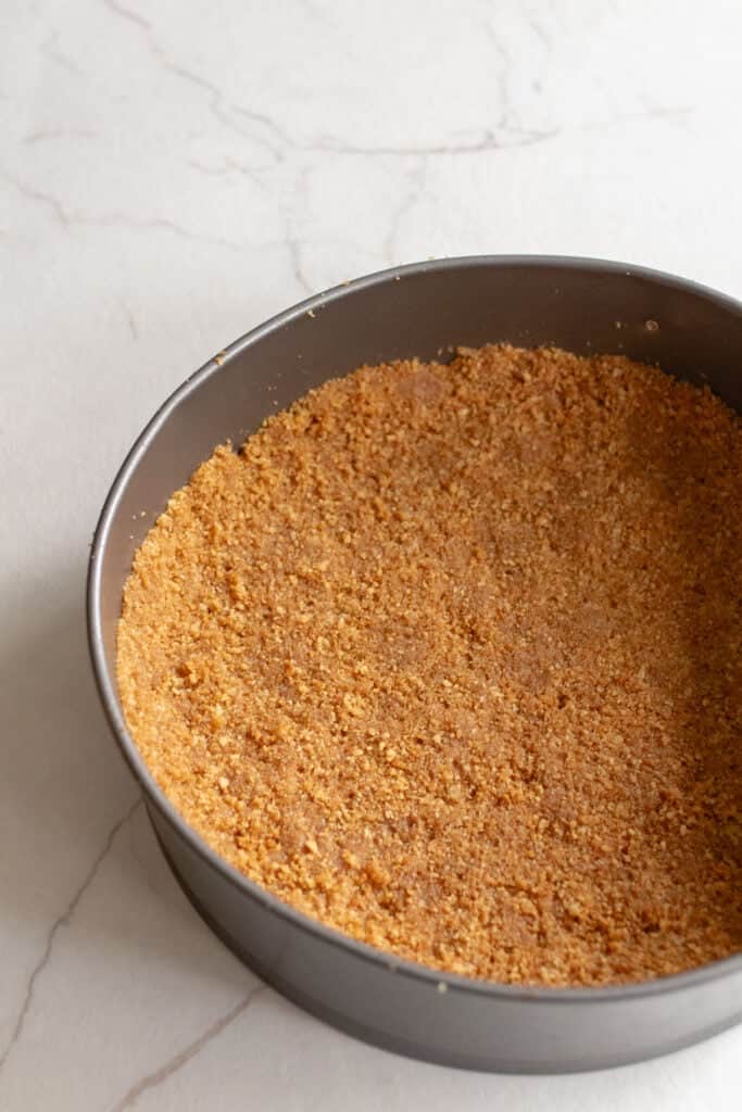 Gingersnap crust to a cheesecake pressed firmly in a springform pan. 