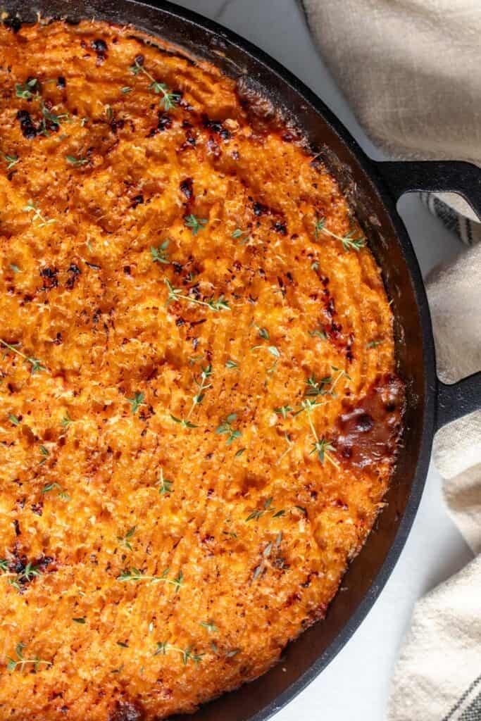 A skillet full of shepherds pie.