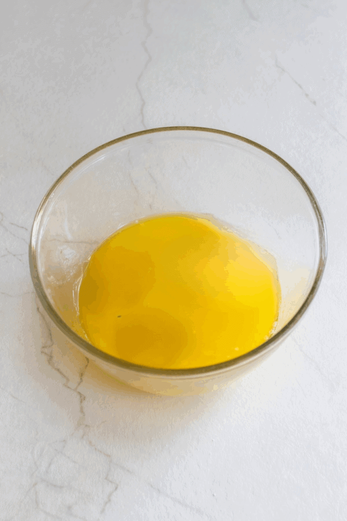 Melted butter in a bowl.