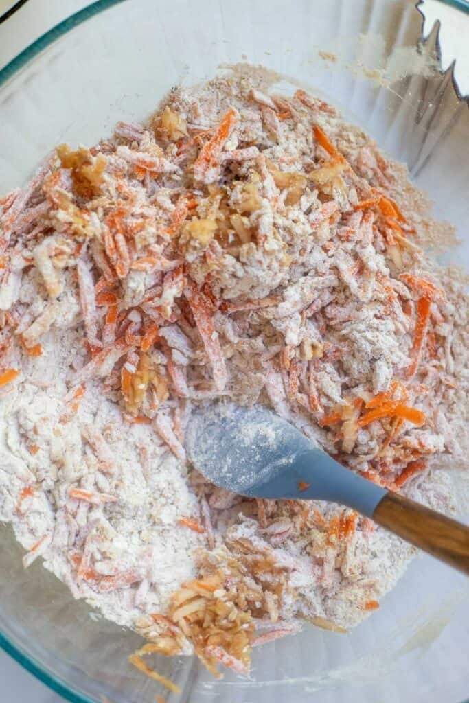Shredded apple and carrots mixed together with the dry ingredients.