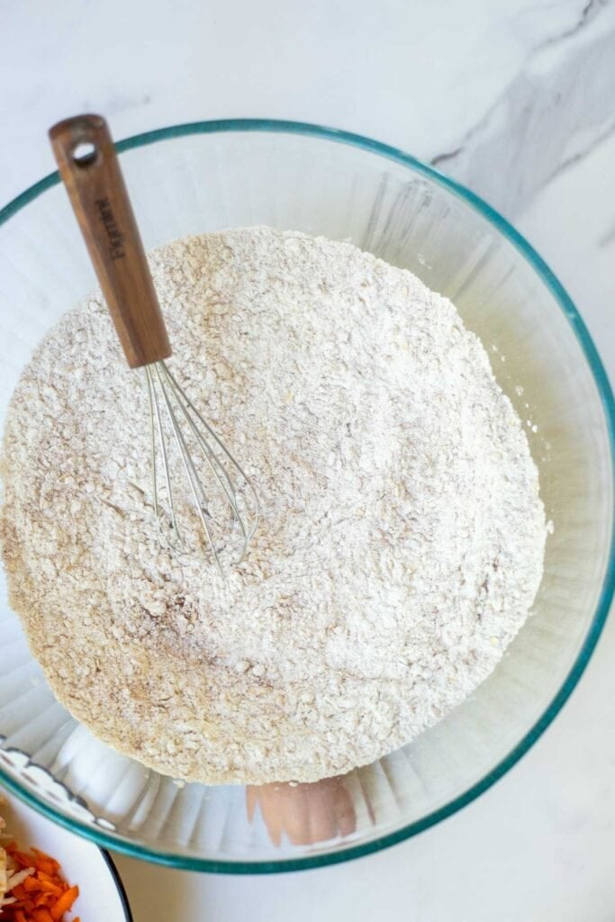 Dry ingredients for the muffin recipe in a large bowl whisked together.