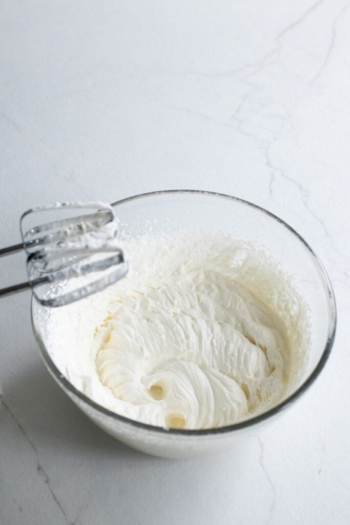Whipped cream in a bowl. 