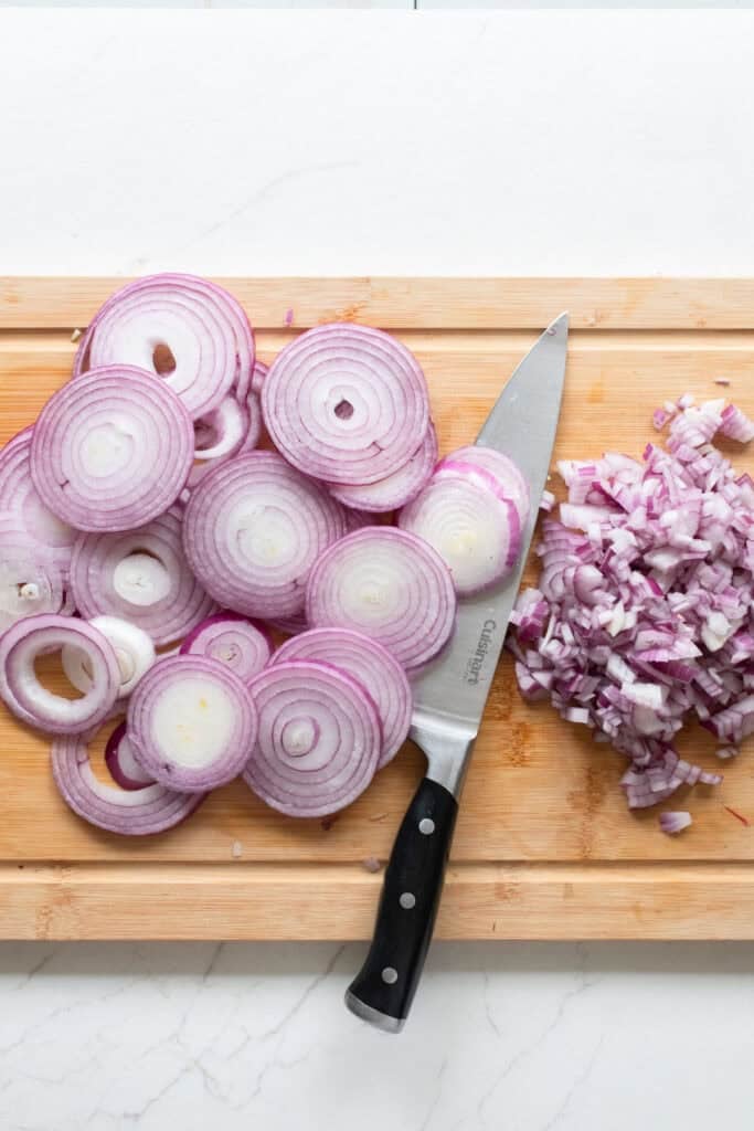 Diced onions on a cutting board.