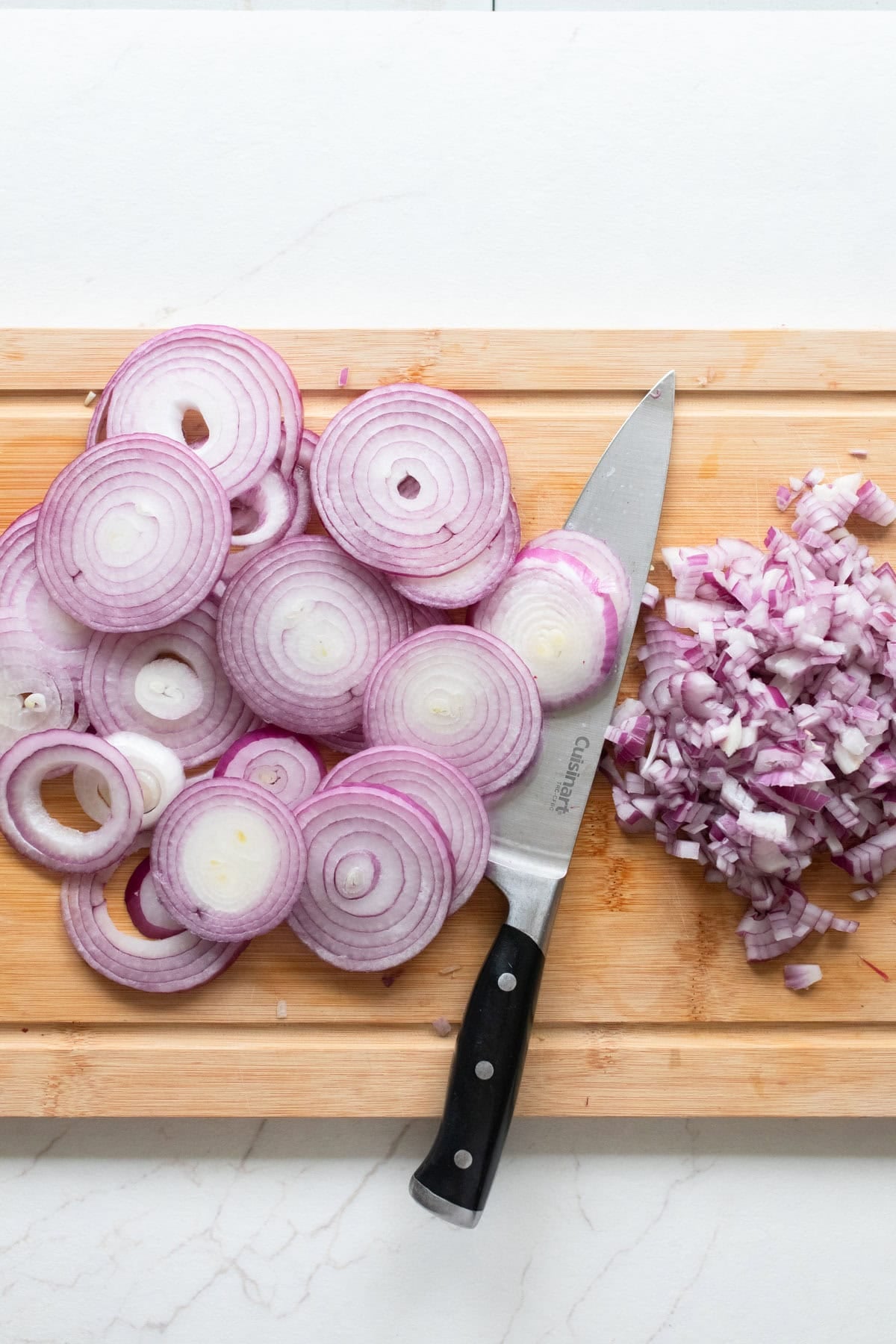 Diced onions on a cutting board.