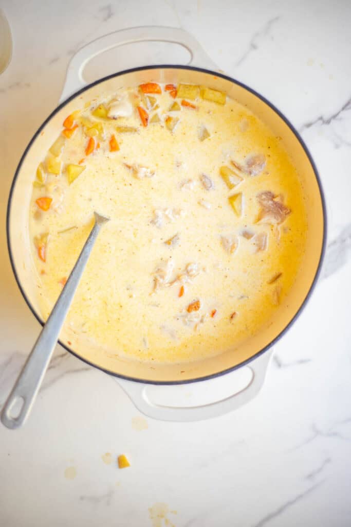 Broth added to Dutch oven with veggies.