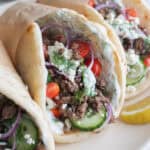 Three gyros on a plate.