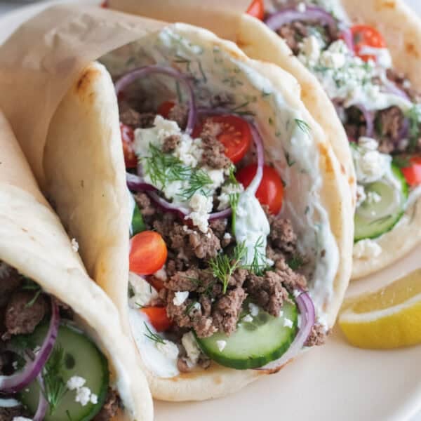 Three gyros on a plate.