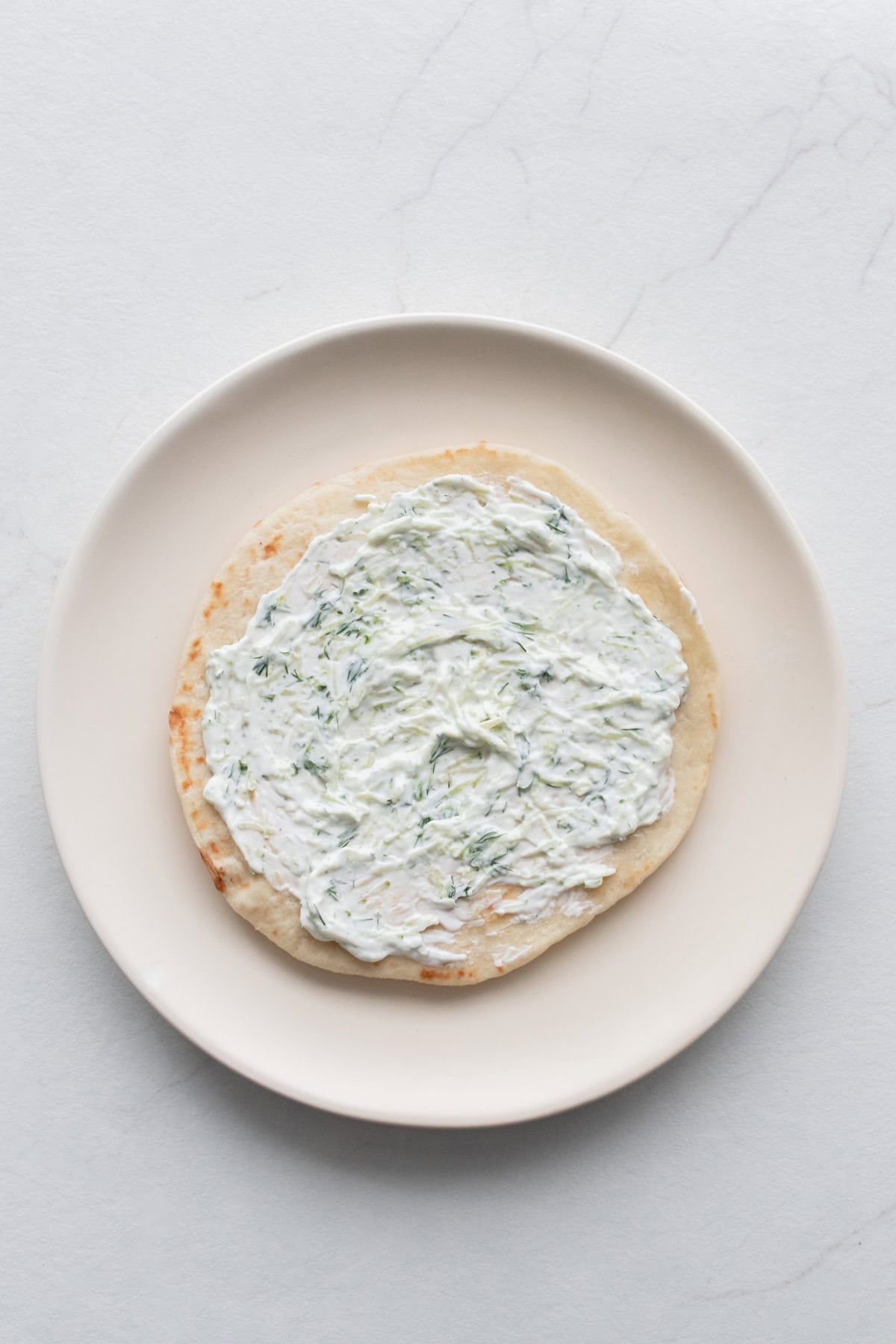 Tzatziki spread on a pita.