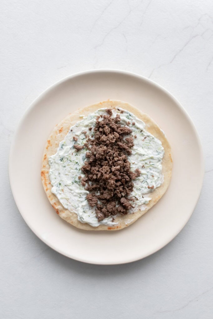 Tzatziki and ground beef on a pita.