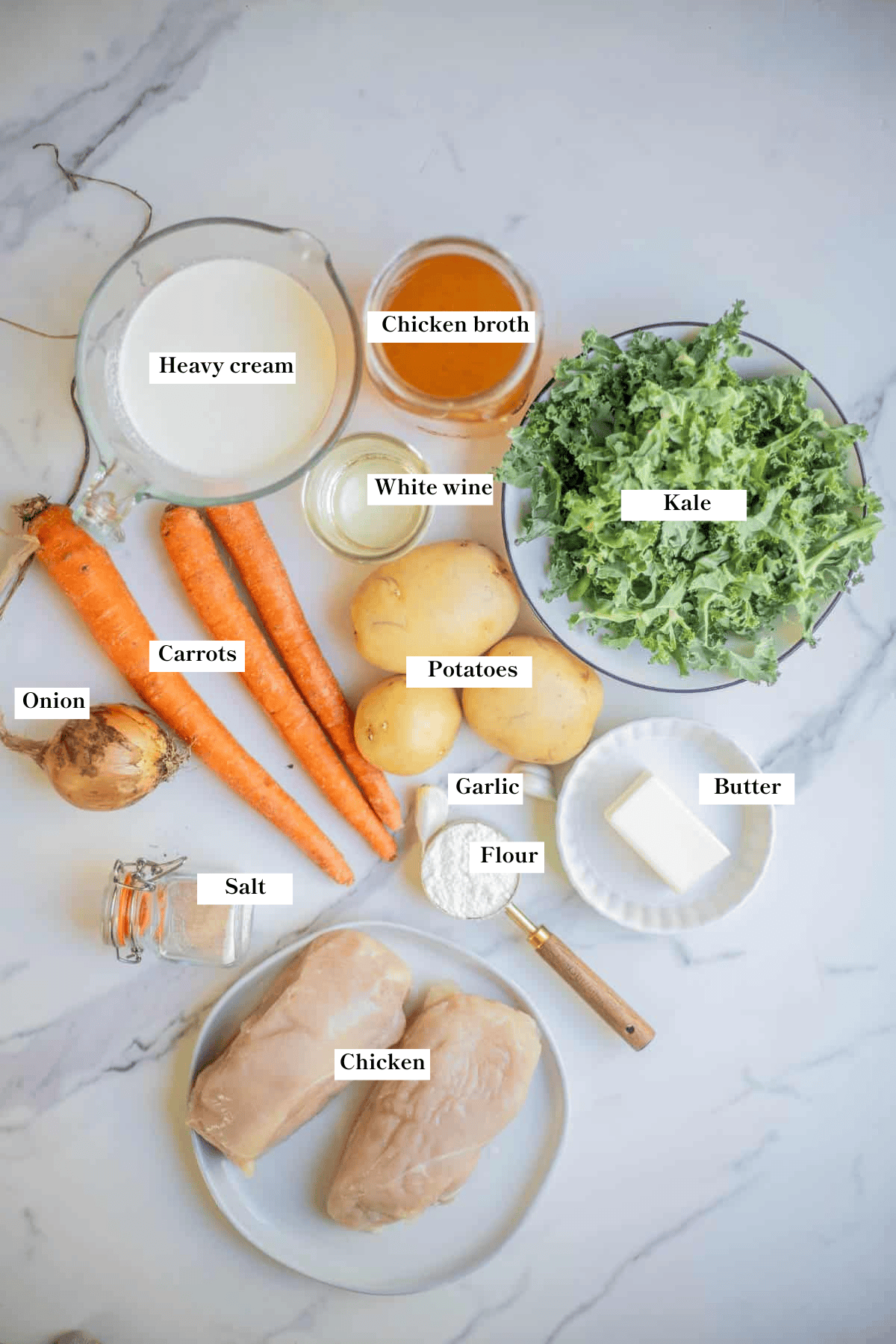 Ingredients for creamy chicken kale soup on the counter.
