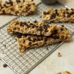 Granola bars stacked on a cooling rack.