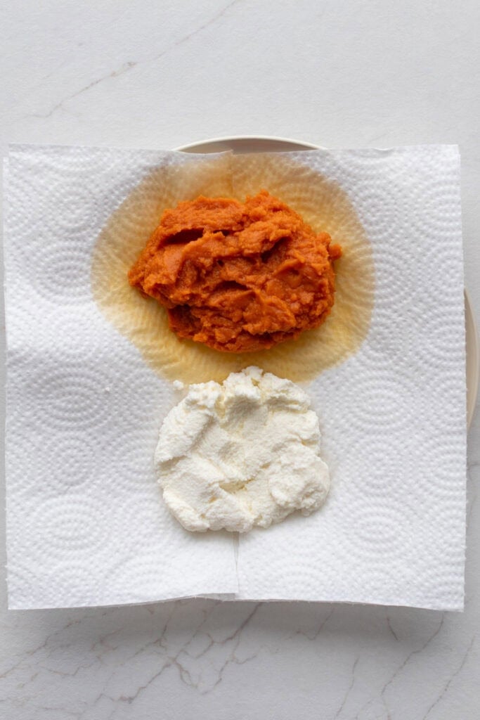 Pumpkin puree and ricotta draining on paper towel.
