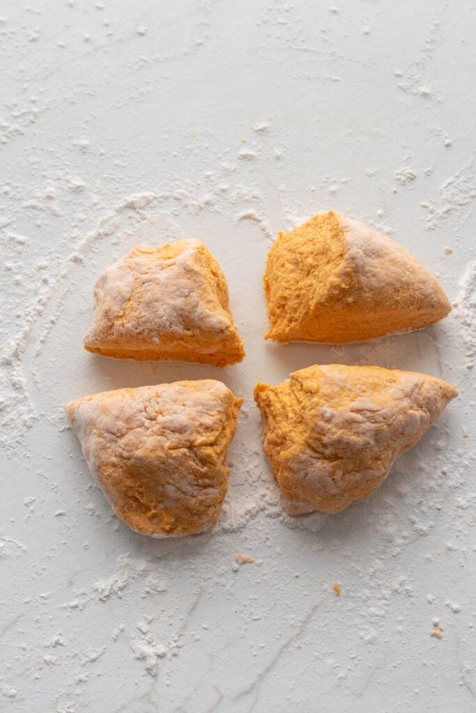 Gnocchi dough cut into four sections.