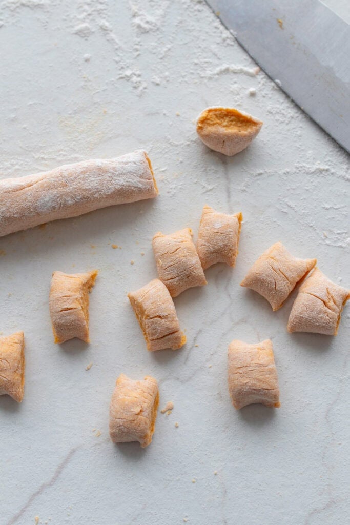 Cutting and shaping gnocchi pasta.