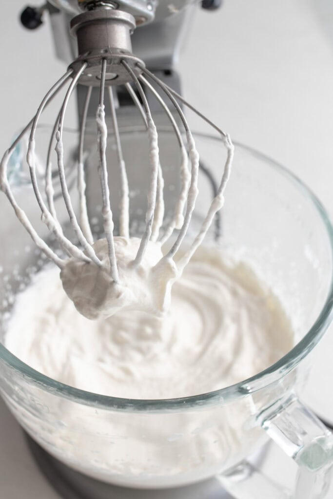Cream in a stand mixer bowl.