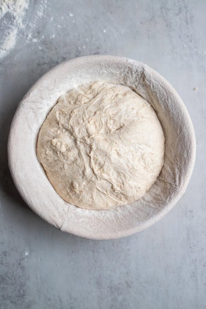 Einkorn sourdough bread shaped and placed in a banneton basket.