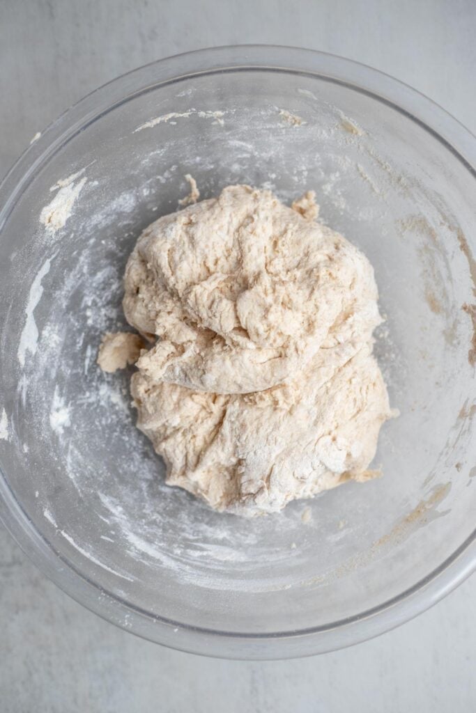 Einkorn sourdough bread dough mixed together in a large glass bowl.