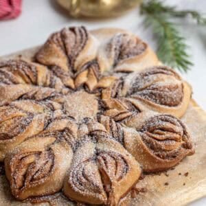 a sourdough cinnamon star bread on a cutting board on the counter.
