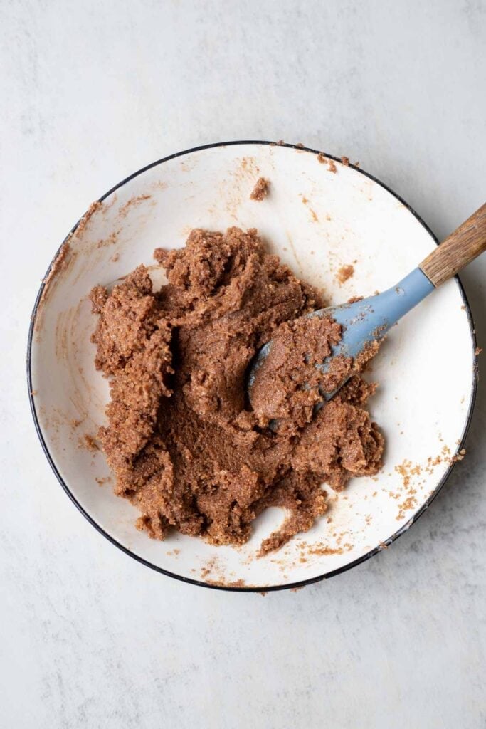 Butter, brown sugar, and cinnamon mixed together in a mixing bowl.