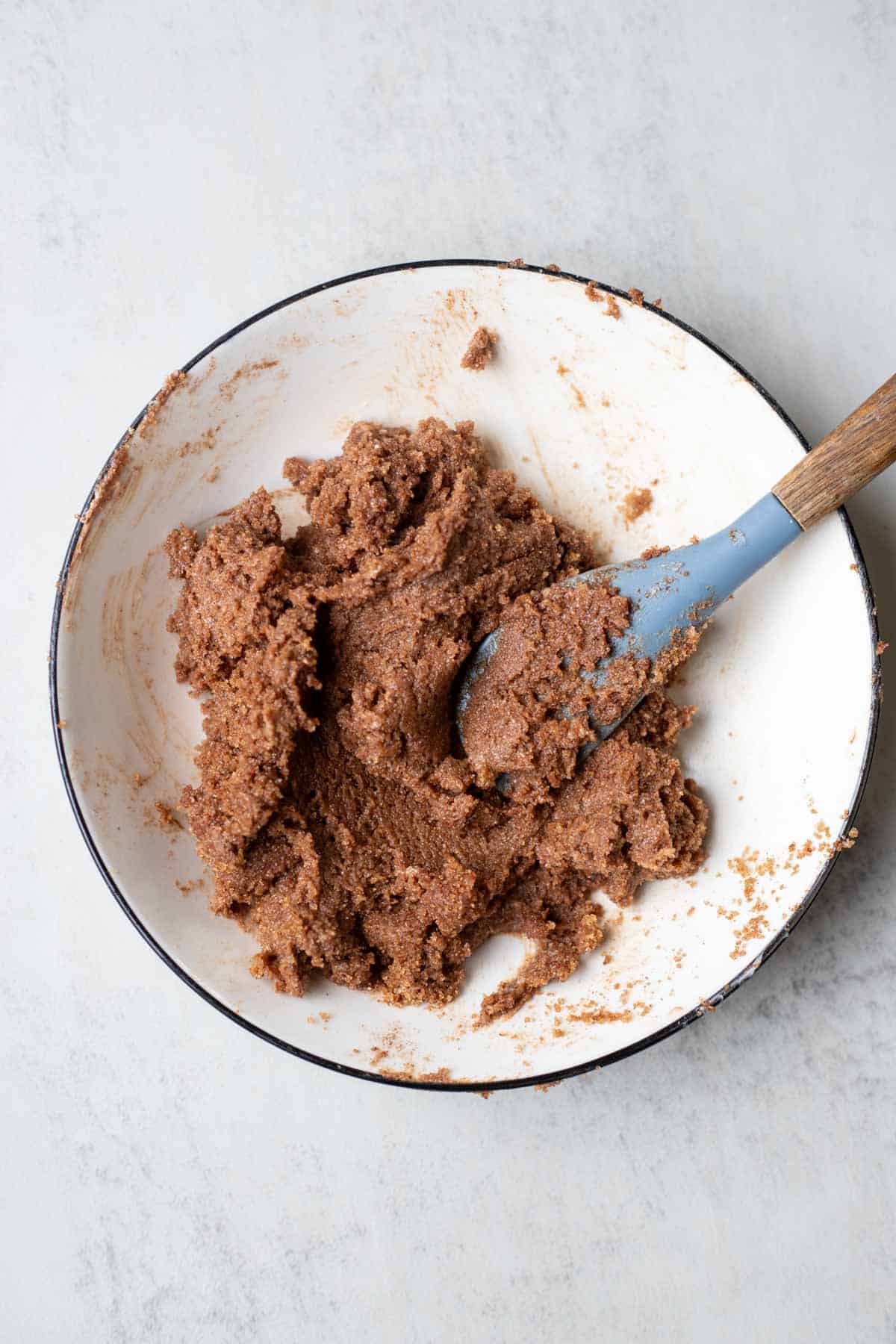 Butter, brown sugar, and cinnamon mixed together in a mixing bowl.