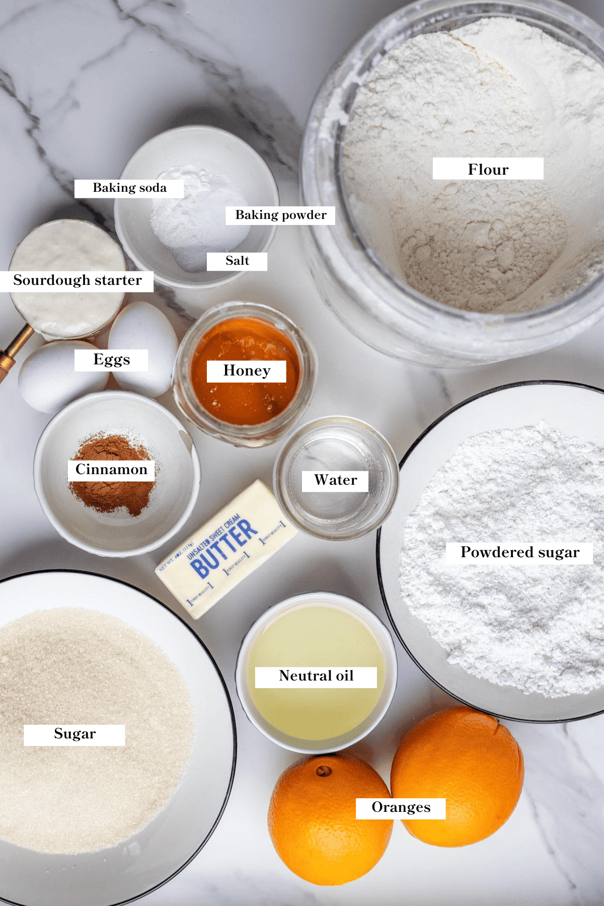 Ingredients for sourdough orange cinnamon rolls on the counter.